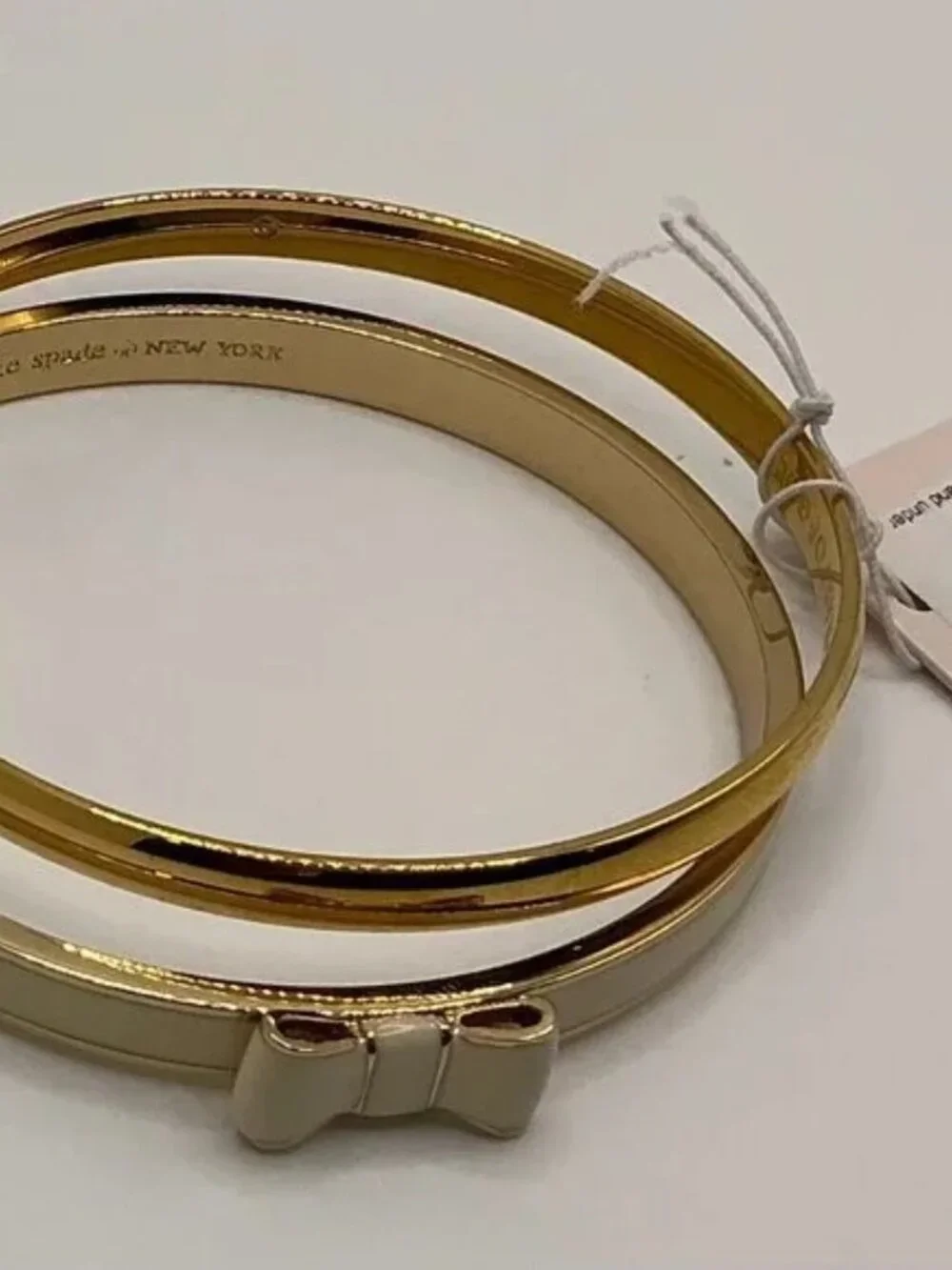 Kate Spade New York TAKE A BOW Gold & Cream/Idiom Gold-Tone Bangle Bracelet - Picture 4 of 9